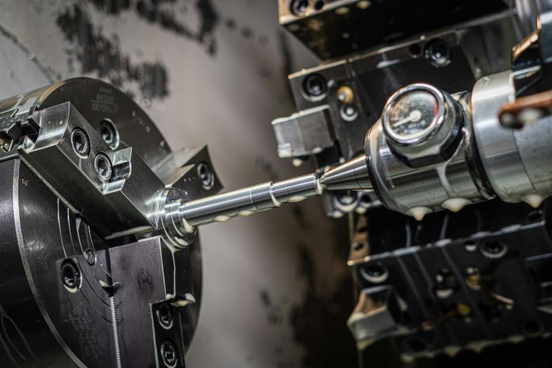 Precision CNC Lathe in Action, machining a metal component