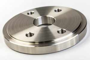 Batch of identical CNC machined aluminum parts, precisely threaded and ready for assembly