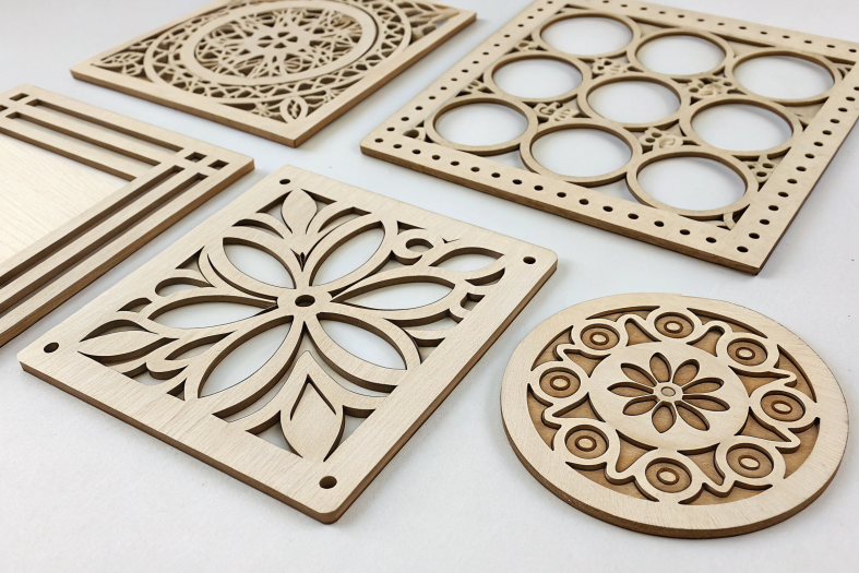 Laser-cut decorative parts, featuring intricate patterns and precise detailing