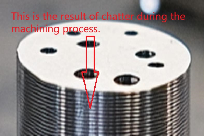 Machined metal part with chatter marks, illustrating machining imperfections